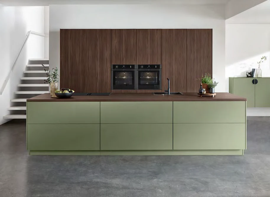 Olive cabinetry and walnut-effect tall units from the Kutchenhaus brochure