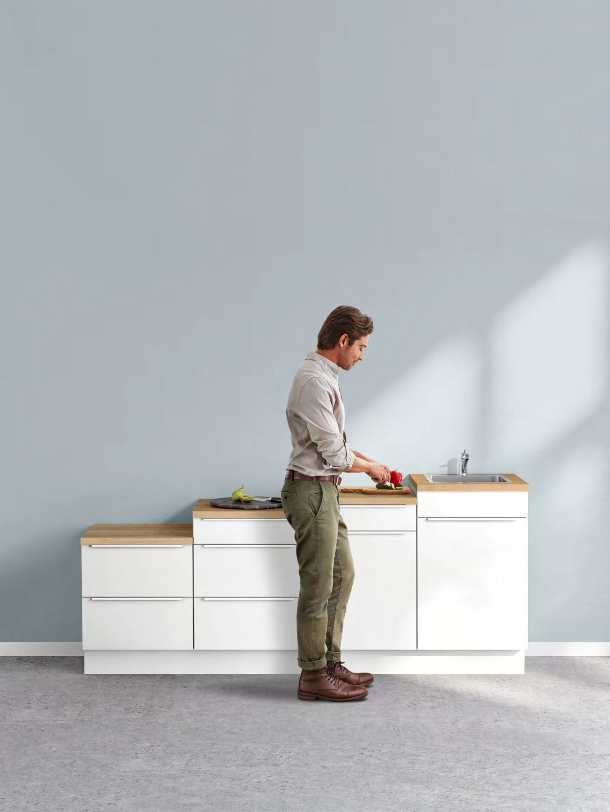 Kitchen worktop height and ergonomics illustrated in the Kutchenhaus brochure