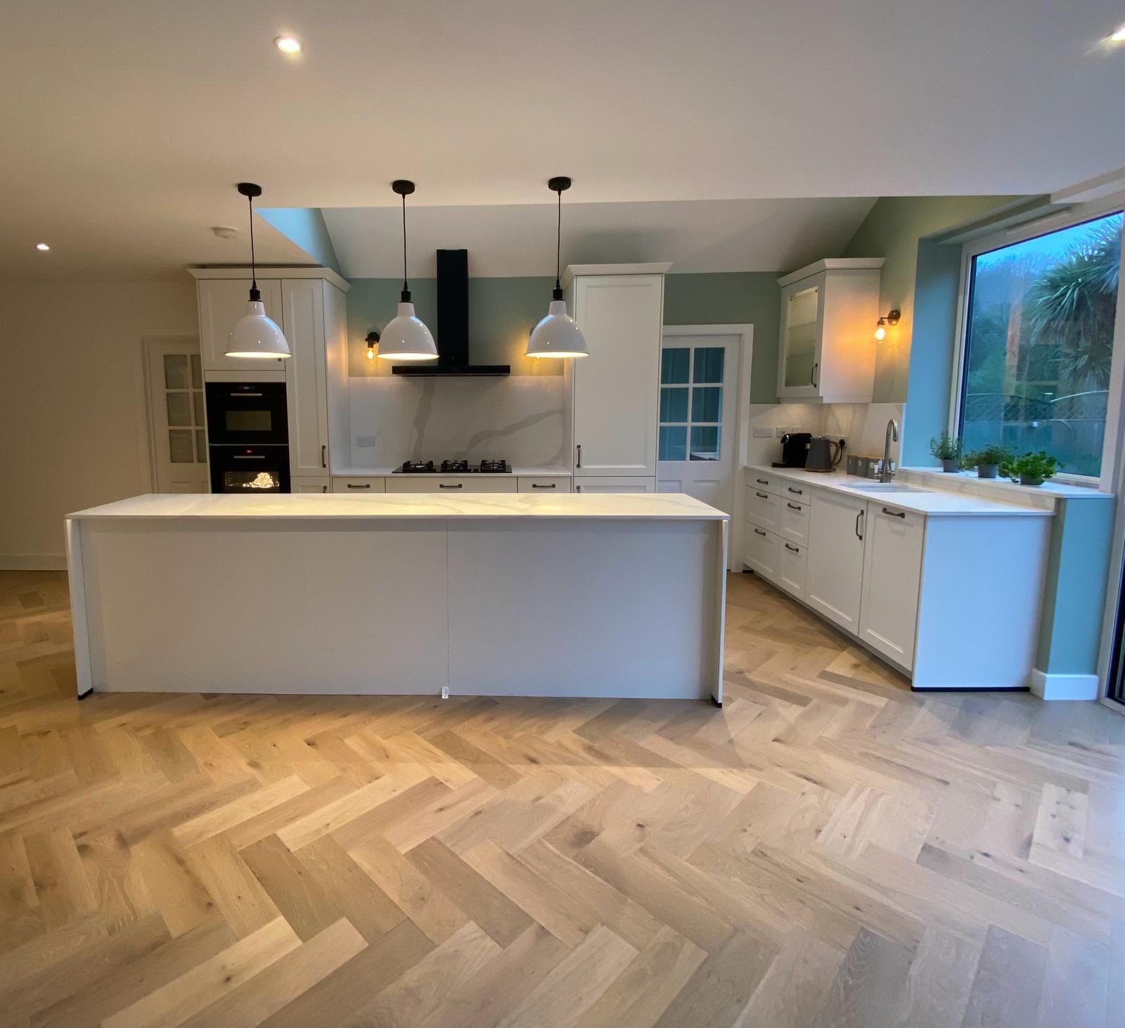 Classic white shaker with herringbone floor