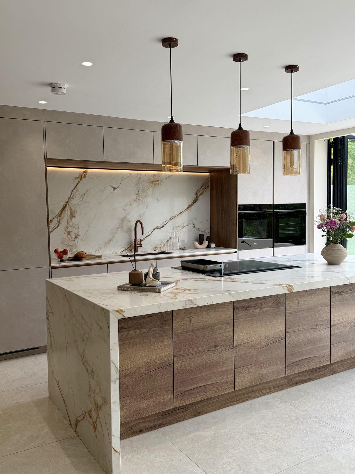 Oak island with veined stone splashback