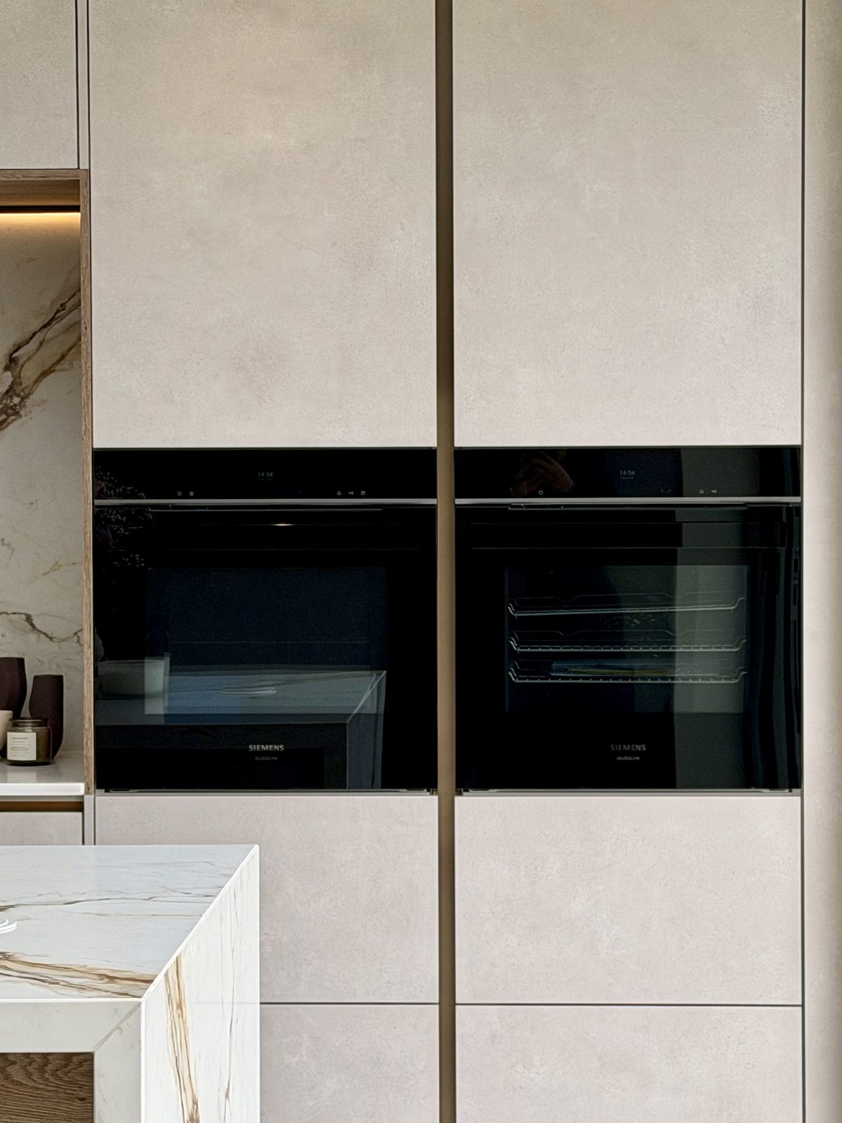 Twin ovens set into a tall bank