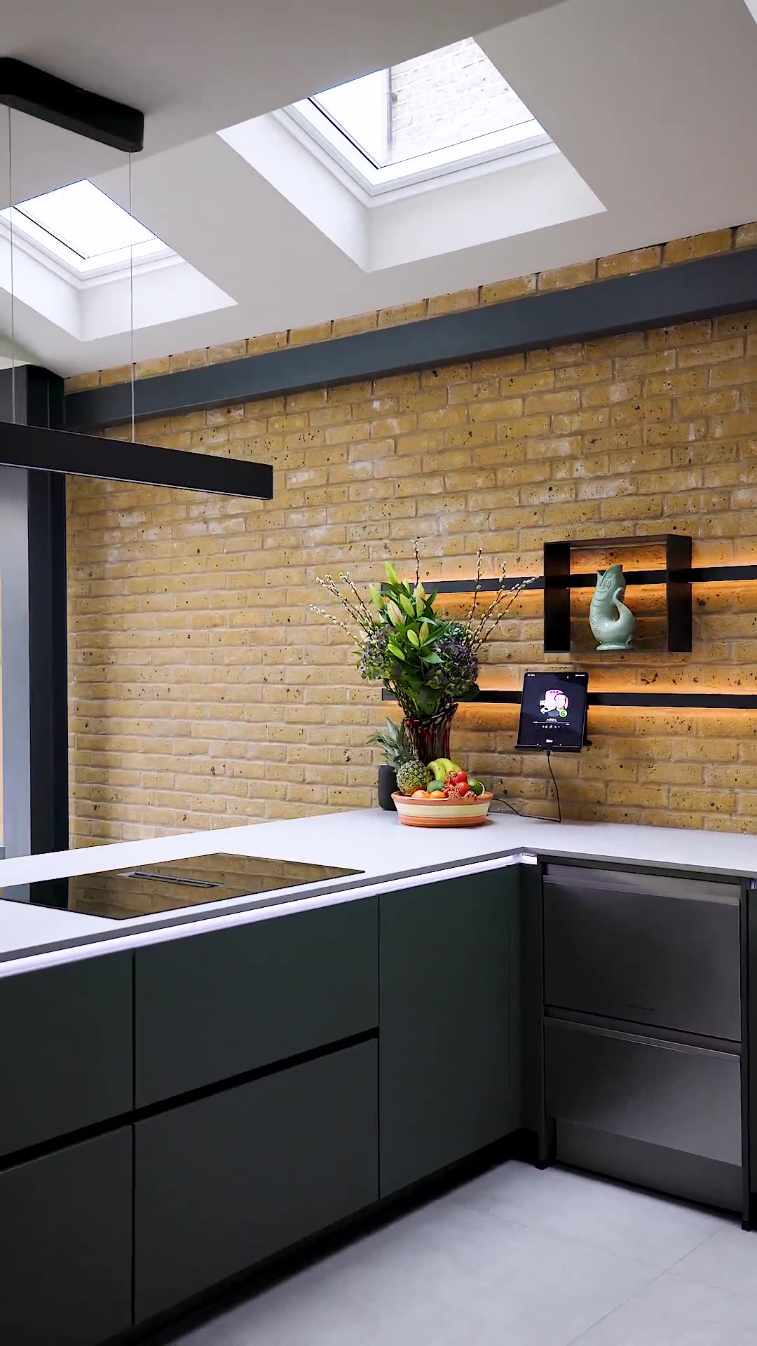 Green handleless against brick and oak